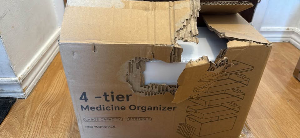 Actual item and packaging: Open 4-tier medicine organizer retail box