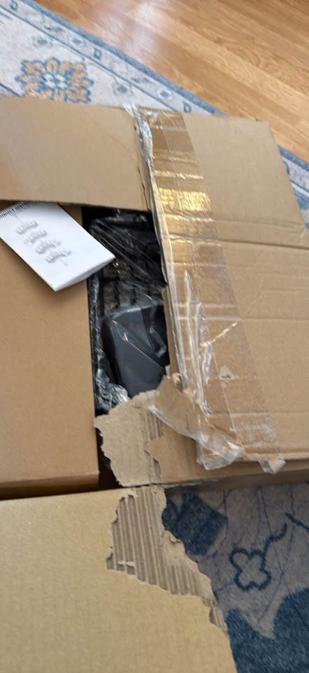 Actual item and packaging: Black caddy components packed in an open cardboard box with instruction sheet