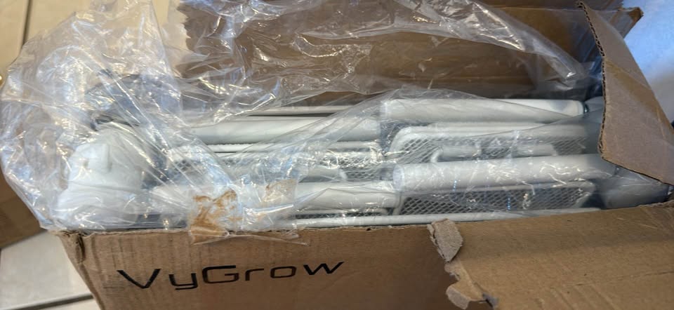 Actual item and packaging: White storage-bin components packed in an open VyGrow box